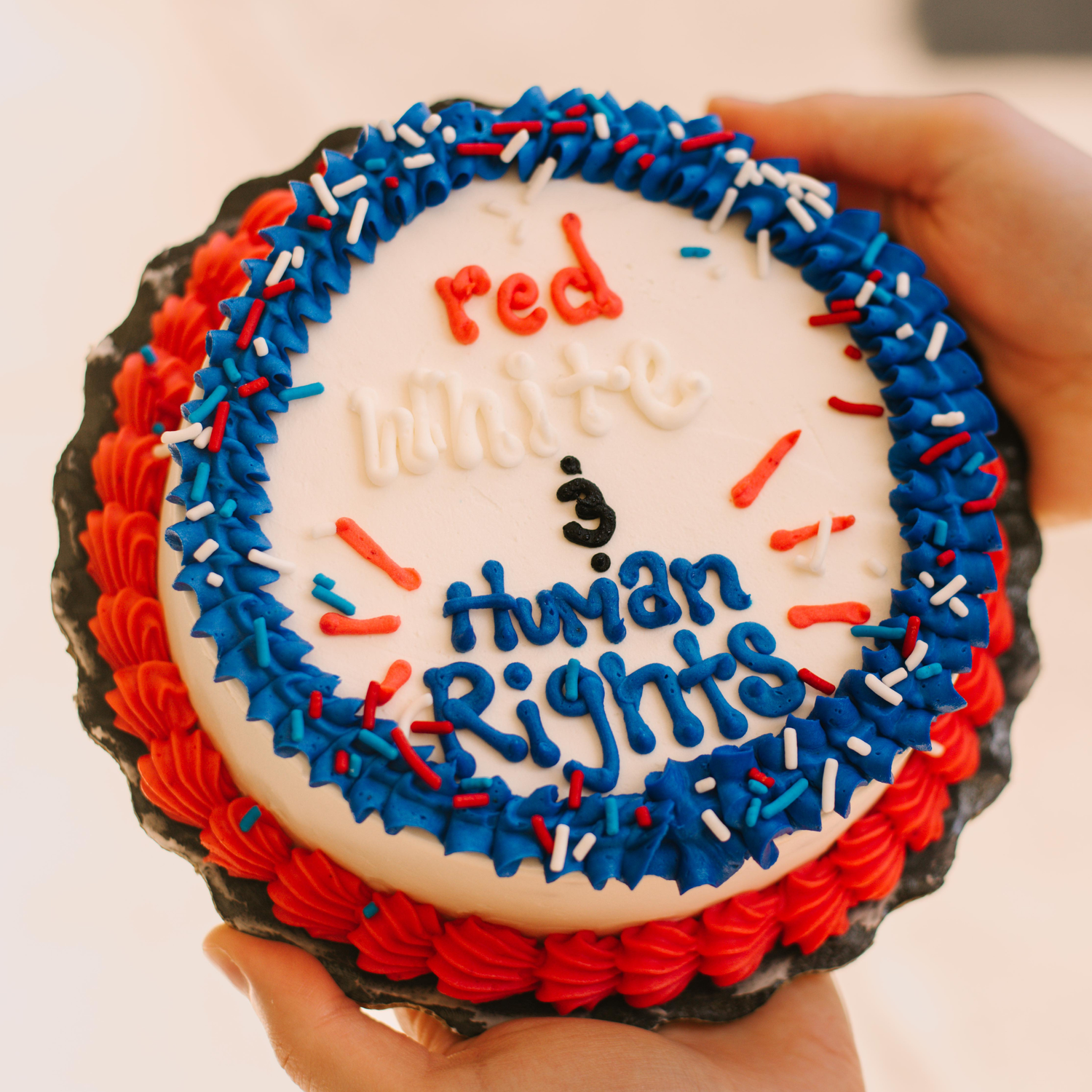 Red, White + Human Rights Smash Cake